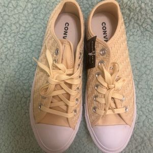 Canary yellow converse all star chicks with a basket weave type design.